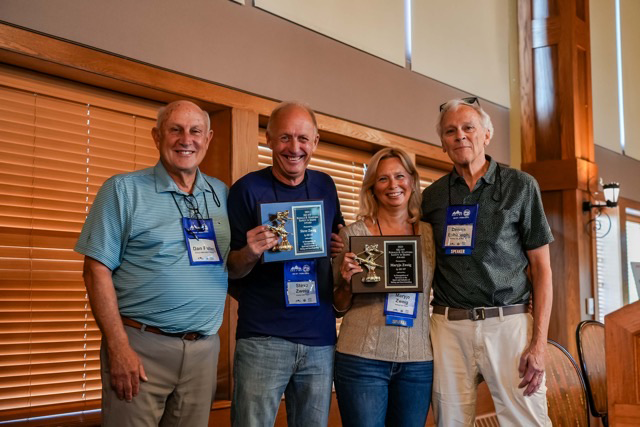 Bristol Mountain S Dan Fuller Left And Holiday Valley S Dennis Eshbaugh Right Presented Attorneys Steve And Maryjo Zweig With The Stafford Safety In Skiing AwardJPG