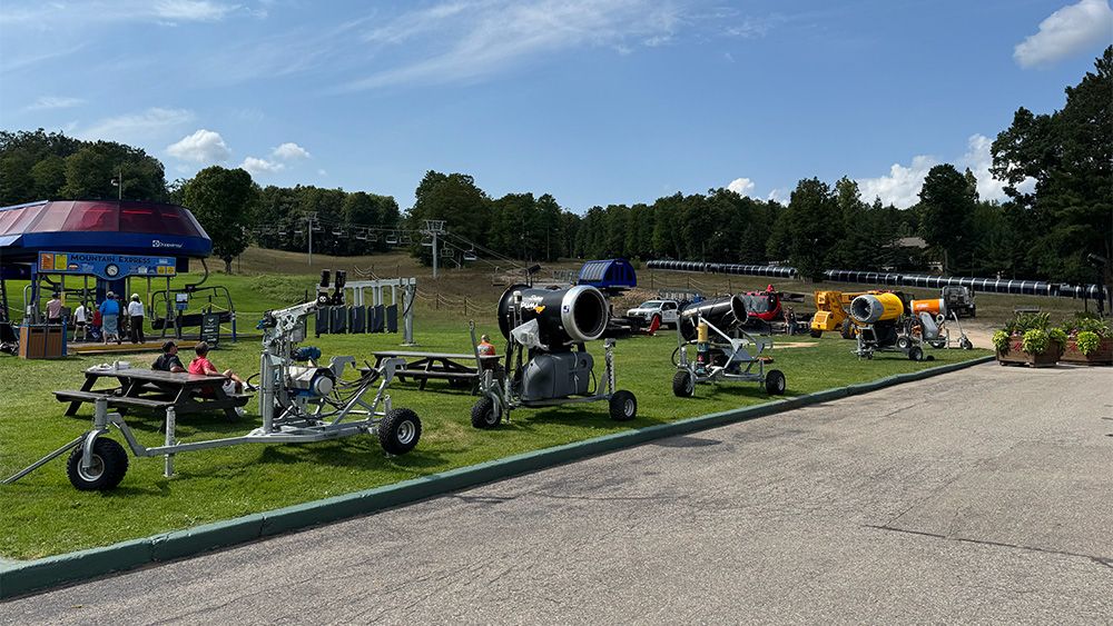 Snow Gun Lineup With Snowcats Keeping A Watchful Eye