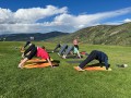 Campers enjoying yoga at the mountaintop