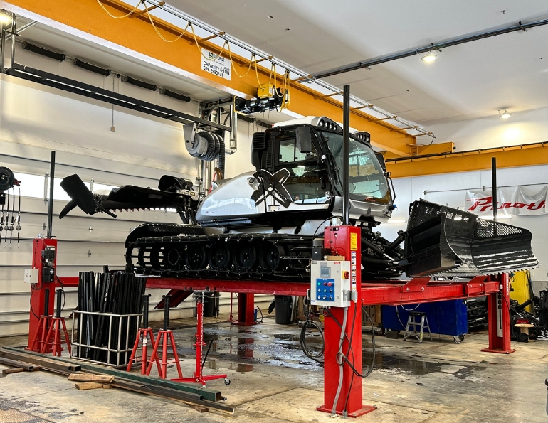 The LIF-TRACK vehicle lift in the middle of the cat bays is accessed on the snow side of the building. The five-ton overhead crane (top center) serves all three snow-side bays.