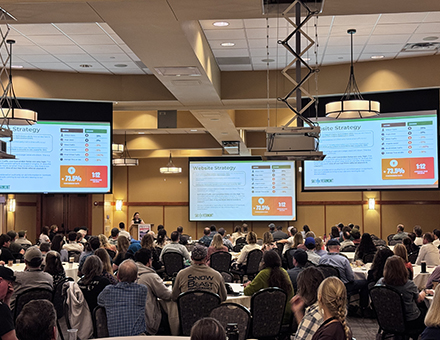 Big crowd getting marketing updates from Ski Vermont marketing and partnerships manager Becca Munkelwitz