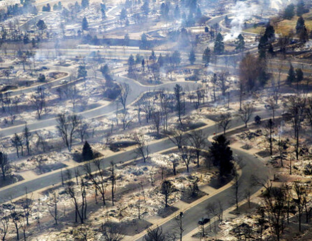 A view of a Boulder County neighborhood that was destroyed by a wildfire is seen from a Colorado National Guard helicopter during a flyover by Gov. Jared Polis on Friday, Dec. 31, 2021. Tens of thousands of Coloradans driven from their neighborhoods by a wind-whipped wildfire anxiously waited to learn what was left standing of their lives Friday as authorities reported more than 500 homes were feared destroyed. (Hart Van Denburg/Colorado Public Radio via AP, Pool)