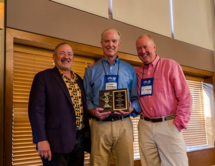 Ski NY president Scott Brandi left honored Windham Mountain Club chairman Chip Seamans with the Ski NY Hall of Fame Award presented by for MountainGuard chief Bo Adams