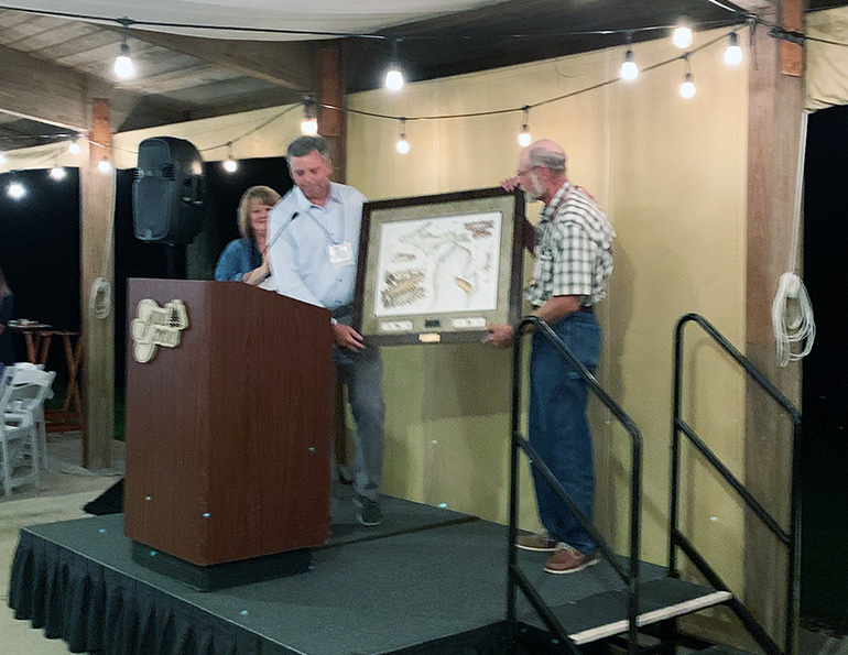 Joe Vanderkelen SMI presents Jim Vander Spoel with the Jim Vanderkelen Achievement Award