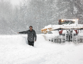 Snowriver, Mich., GM Benjamin Bartz measures pre-holiday snow in body lengths.