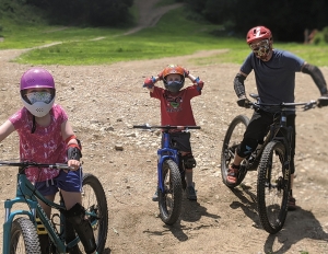 A family enjoys the bike trails at Thunder Mountain Bike Park, Mass., last summer.