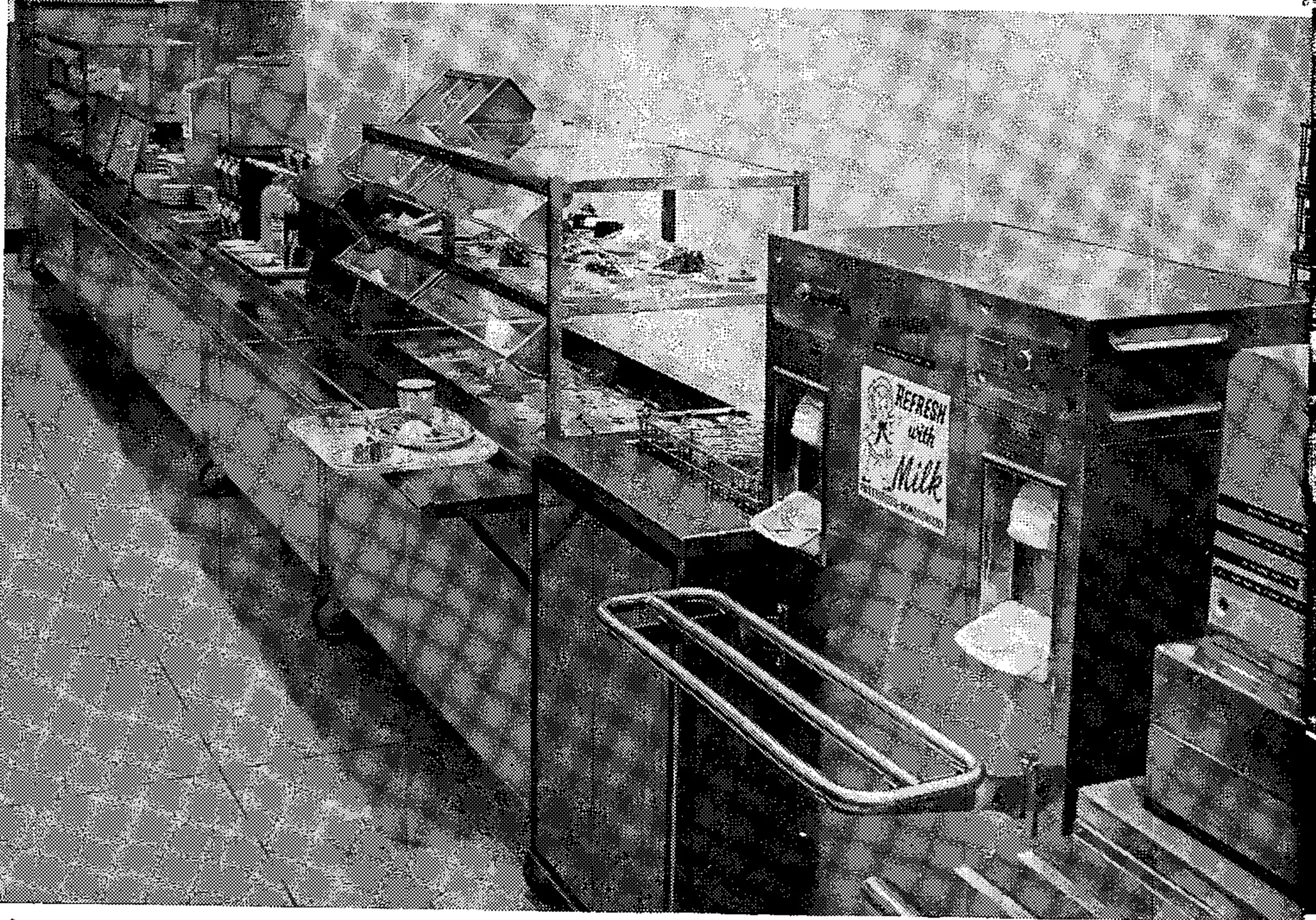 Mobile serving line allows flexibility. Line can be set up according to meal or volume anticipated. Serving line pictured includes non-refrigerated cold display table for salads; hot table with four hot items; beverage and napkin counter; condiment and bread counter; juice and desert station; self-leveling glass dispenser next to two-hole, pre-portioned milk dispenser; cashier station. Self-service beverage station is located far away from the serving line.