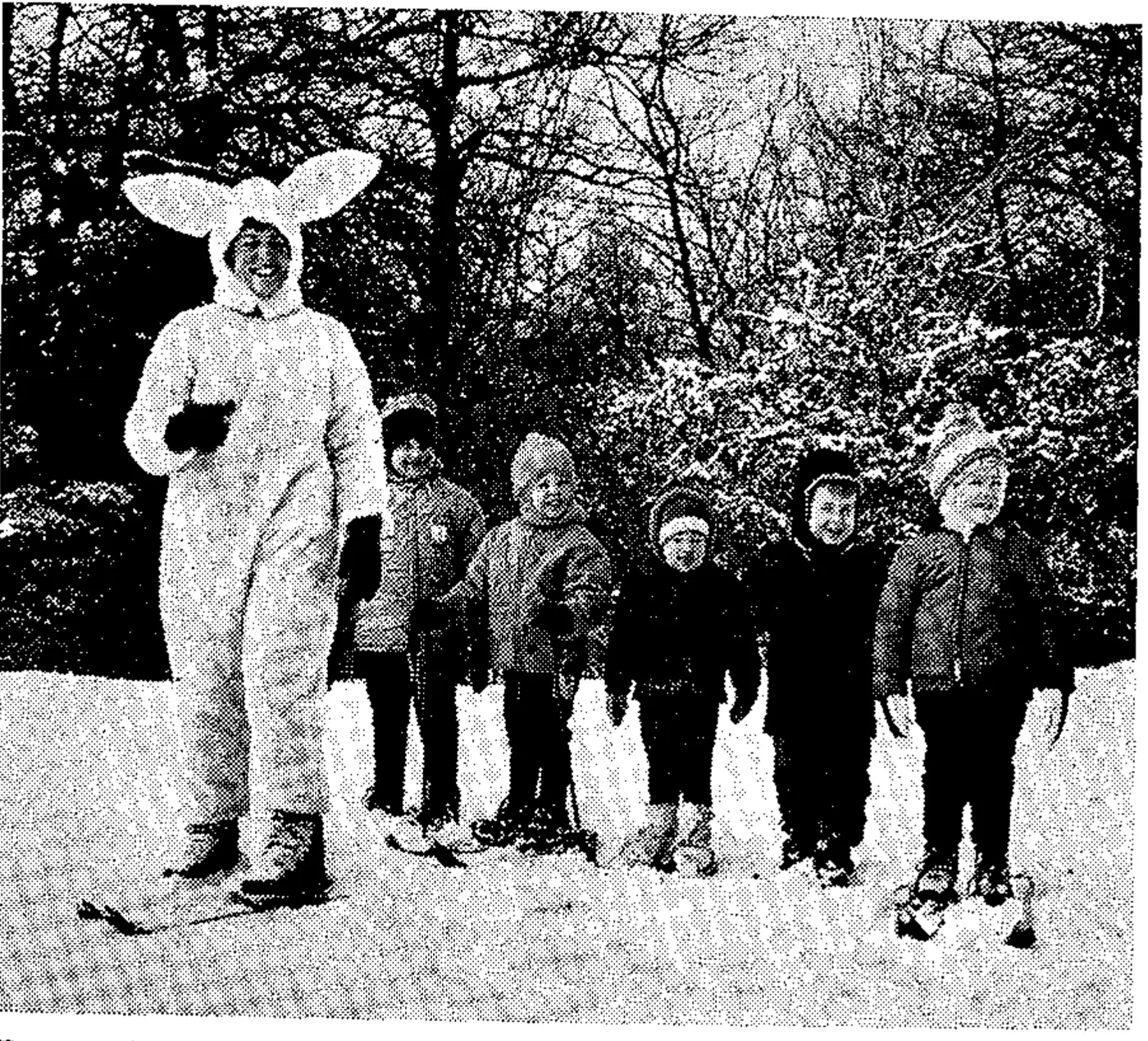 Peggy Resconsin of the Blue Knob, Pennsylvania, ski area leads small students through Alice in Wonderland setting.