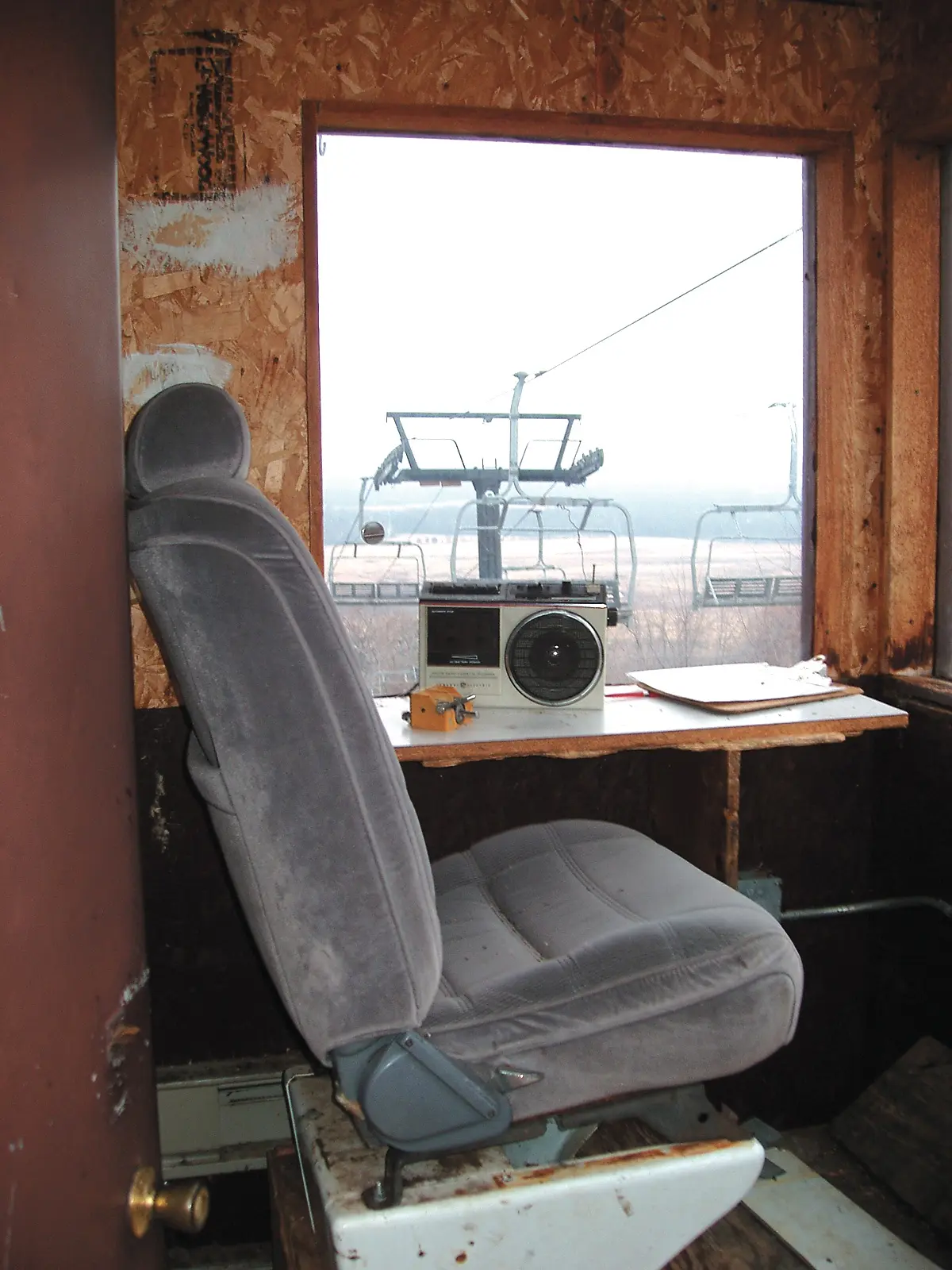 Recycled car seat mounted in a lift attendant shack