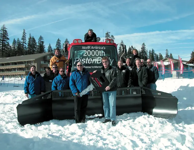 Mammoth Mountain crew posing on the 2,000th North American PistenBully groomer
