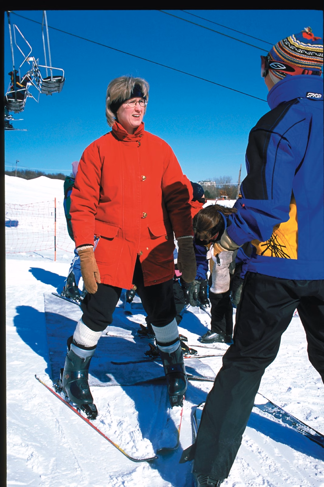 Instructor helping a young skier at Hyland