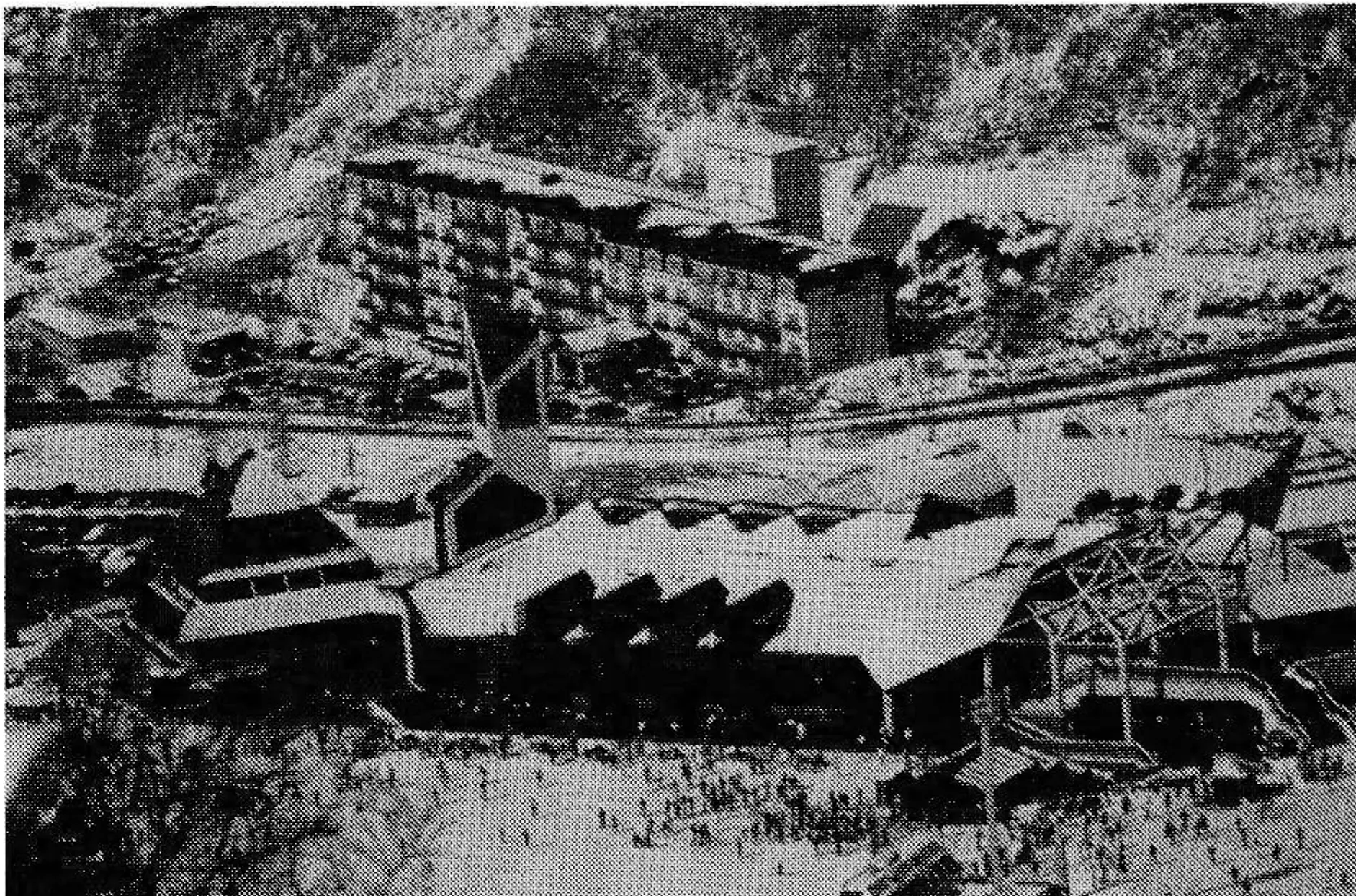 Muju's three-story base lodge is in the foreground.