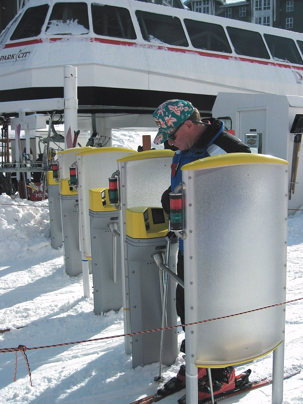 Skier passing through lift-line turnstiles