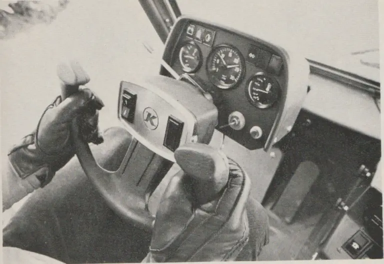 Pisten-Bully 17OD with aircraft-type steering wheel and electronic variable response hydrostatic drive. Note turn signal lever on left side. Rocker switches on wheel are for high/low range and forward/reverse.