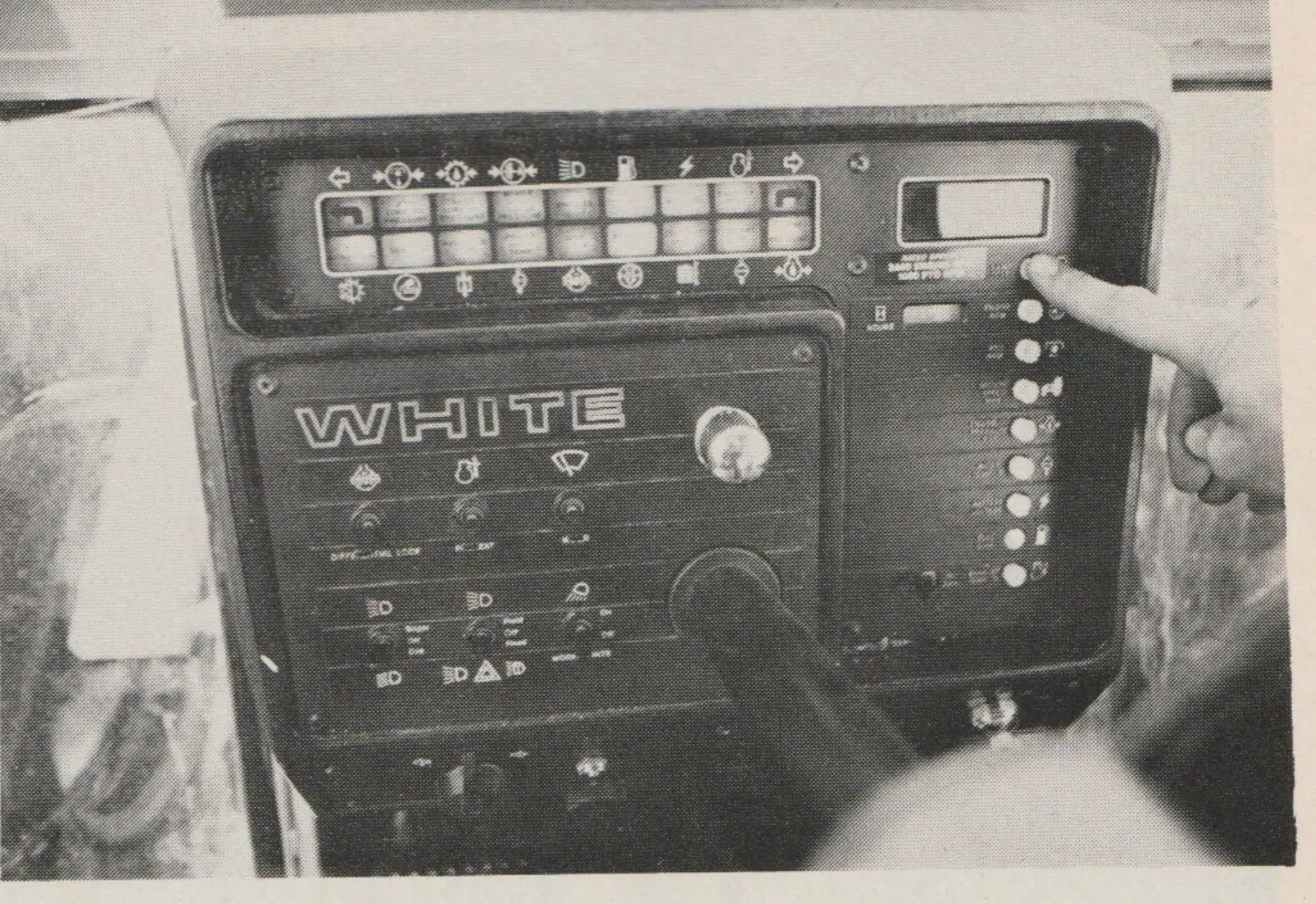 White 210 Tractor has color-coded and lighted panel directly behind steering wheel. Also LED readout at top right shows instantaneous reading of speed, RPMs, oil pressure etc.