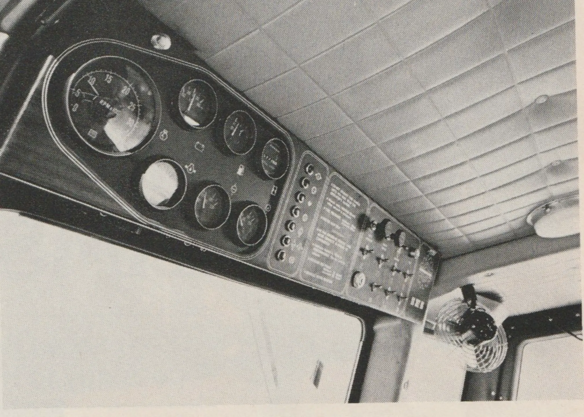 Bombardier 302HD shows well-padded and pleated interior with ample overhead gauges. Note fan on right which can be used to clear front or side windows. Windshield is insulated glass.