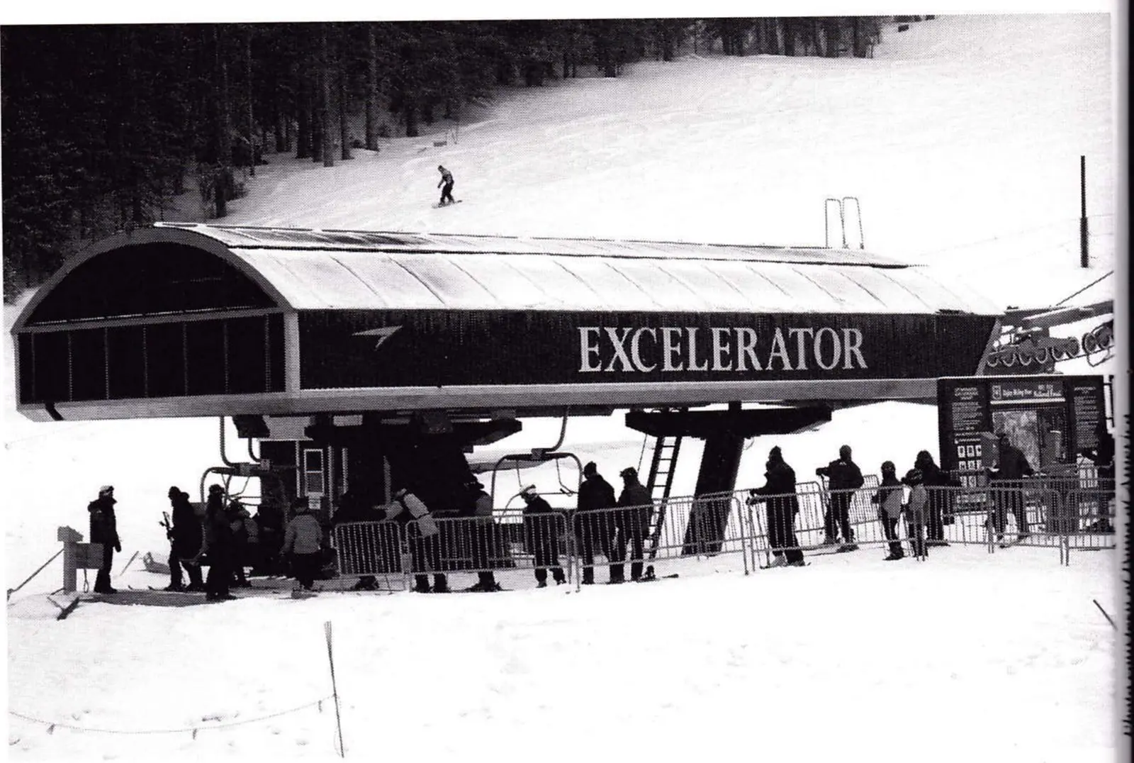 Guests in a side maze loading chairs at the Excelerator detachable quad terminal at Copper Mountain