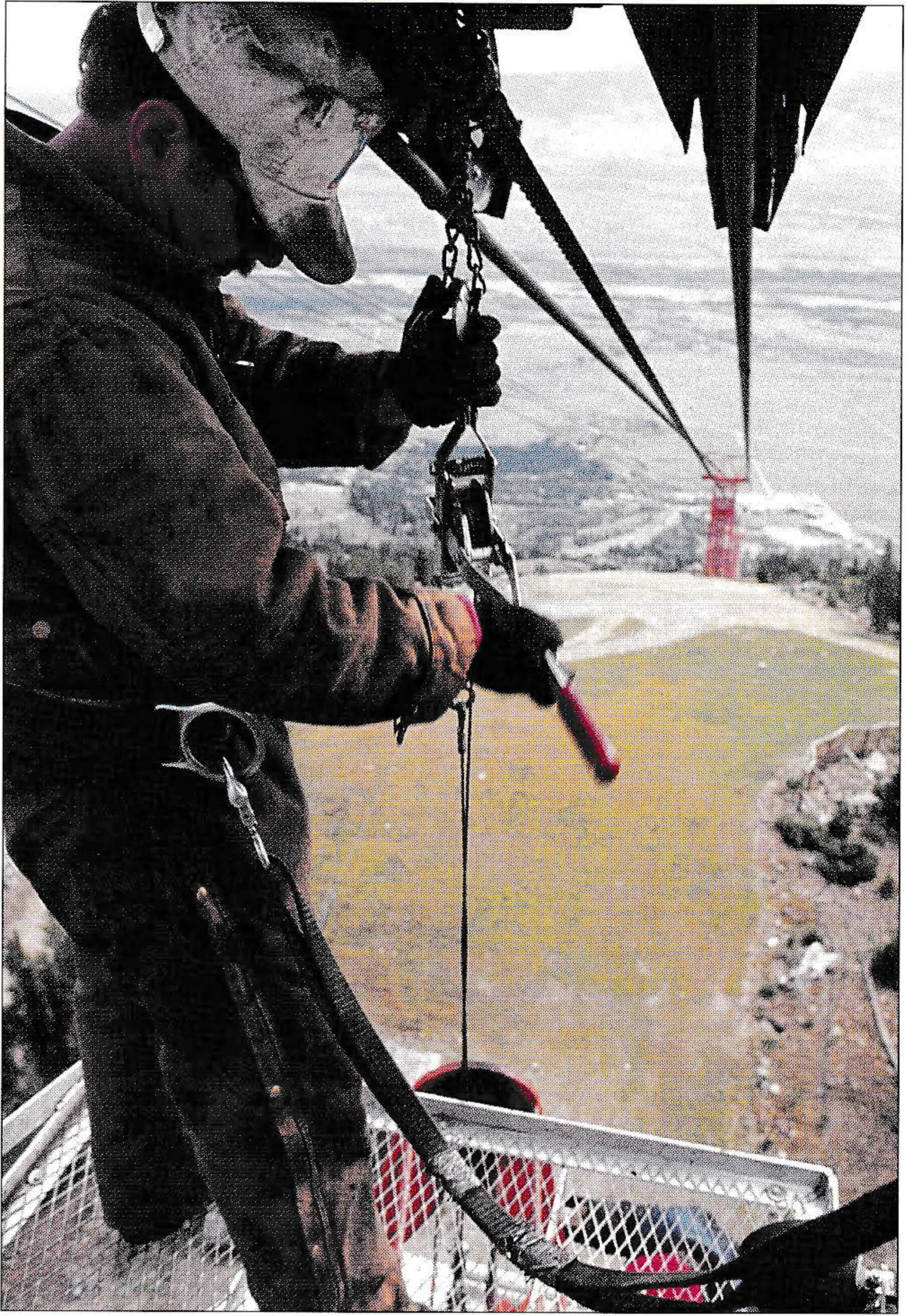 Removing the slack line carriers while preparing the tram line for the slip. Photo by Angus Thuermer.
