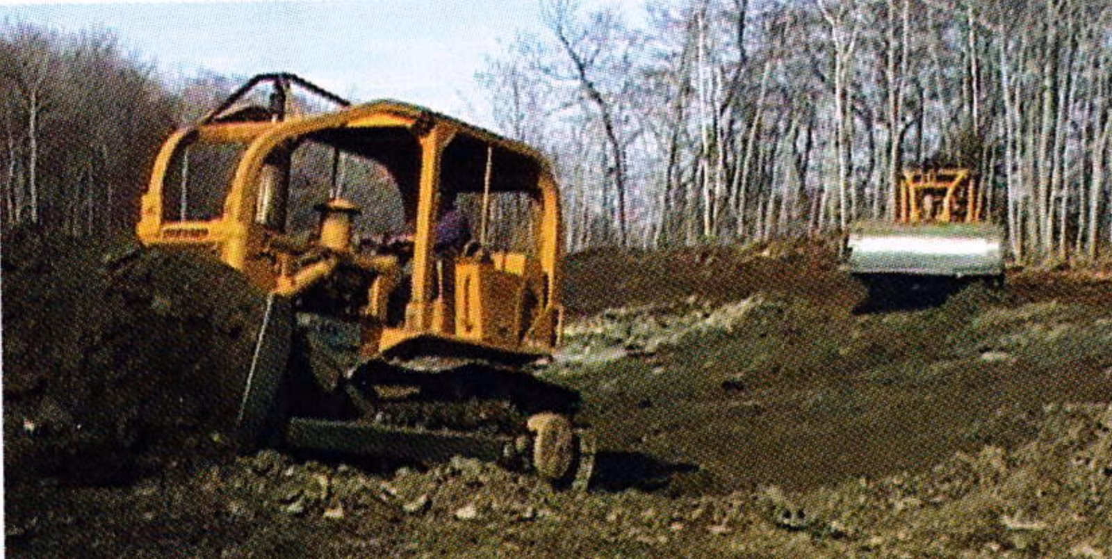 Bulldozers working in the reservoir basin at Brodie Mountain