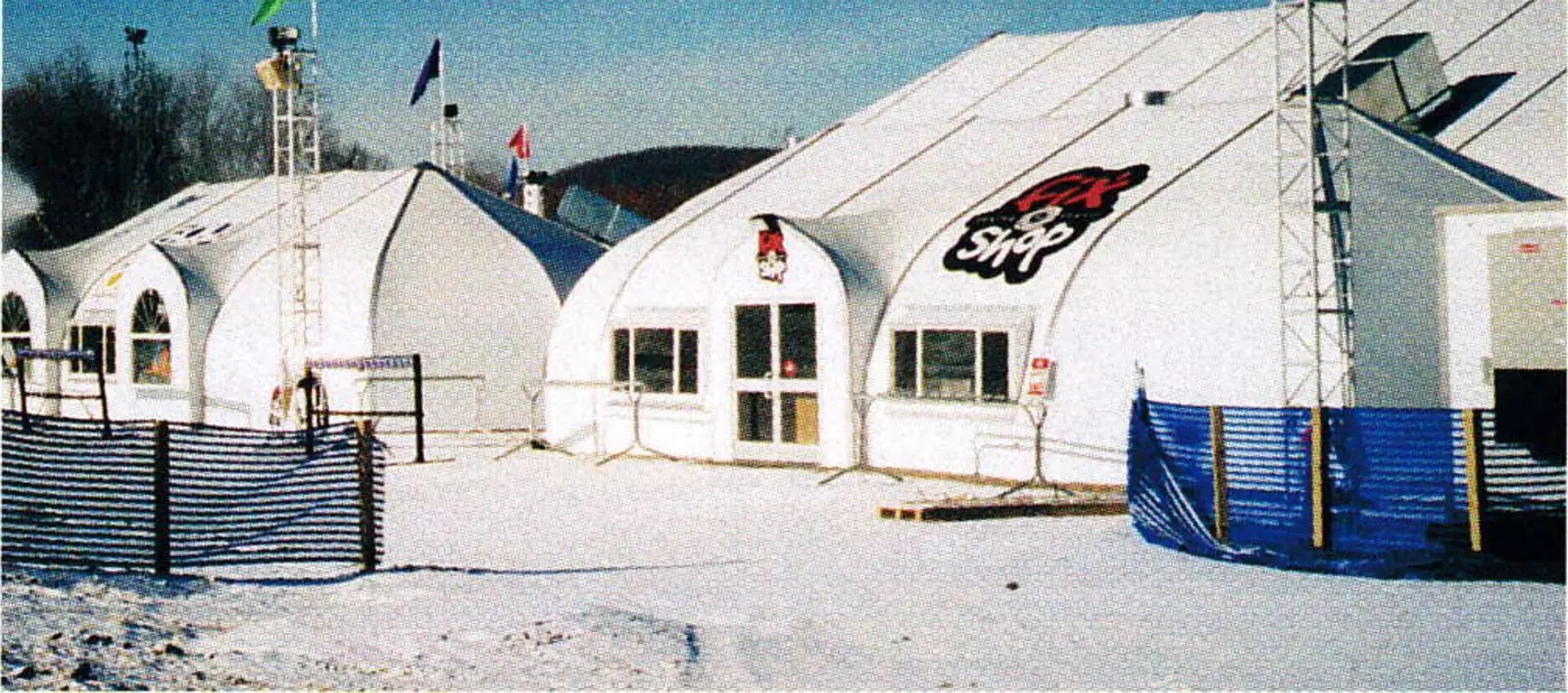 Temporary structures of polyester fabric stretched over an aluminum framework will be replaced with a permanent base lodge during the summer of 2001.