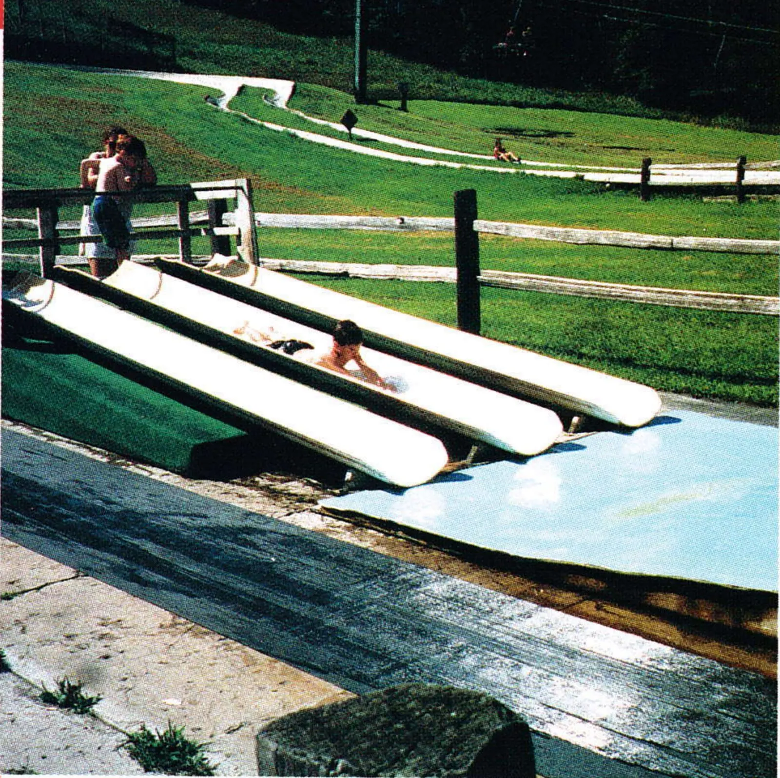 Kiddie waterslides made from halved PVC pipe at Wild Mountain