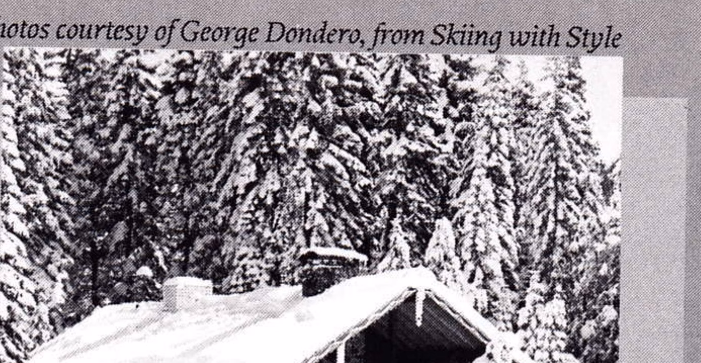 Snow-laden roof of the 1930s Gray house at Sugar Bowl with fir trees behind