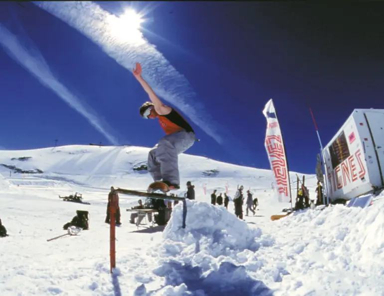 Rider on a snowdeck in mid-air