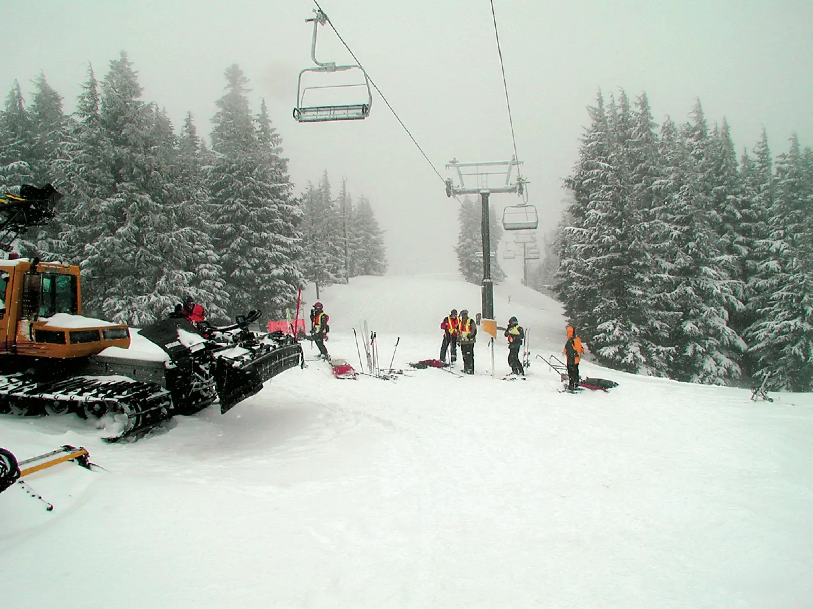 Mass casualty drill on a snowy slope beneath a chairlift