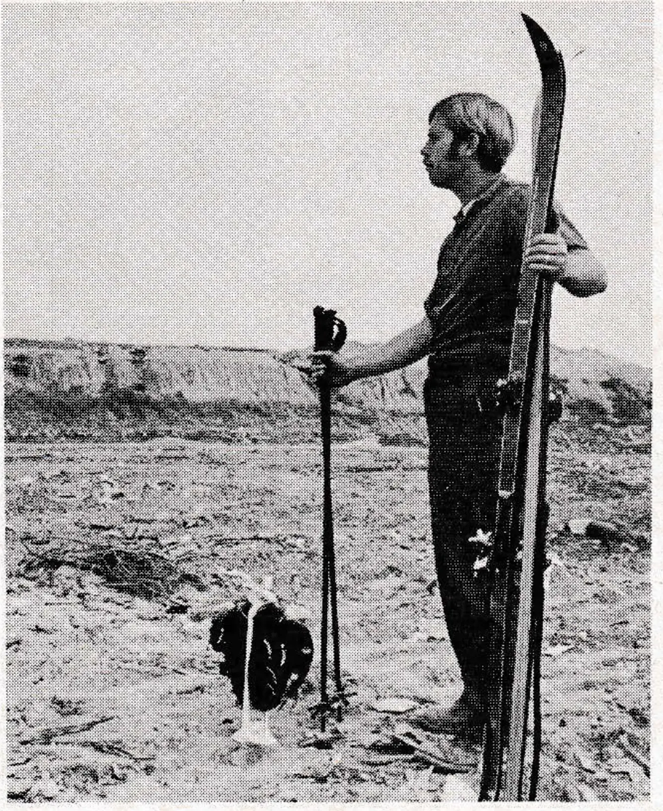 An anxious skier sizes up progress at the area. Completion date is set for 1976.
