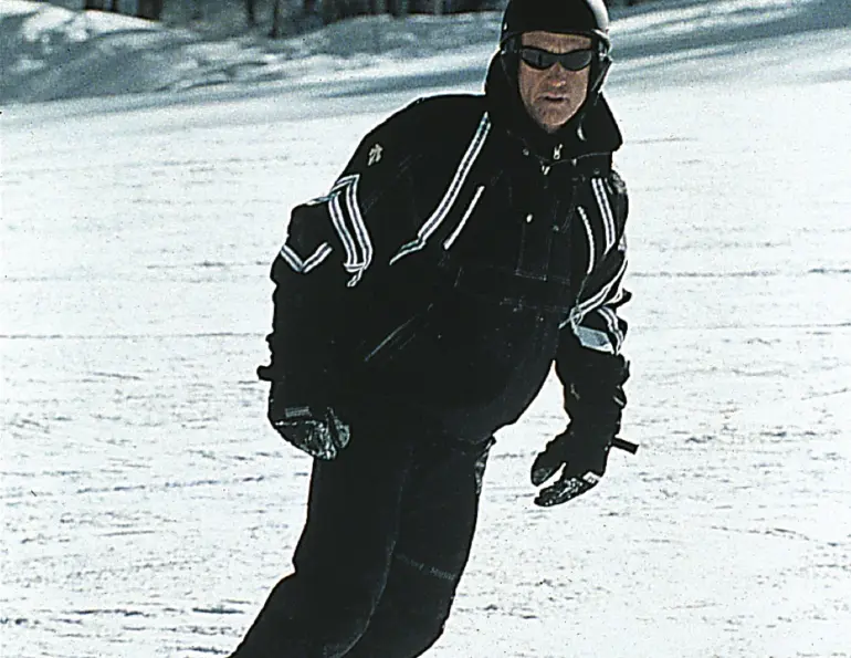 Pat O’Donnell snowboarding down a groomed run
