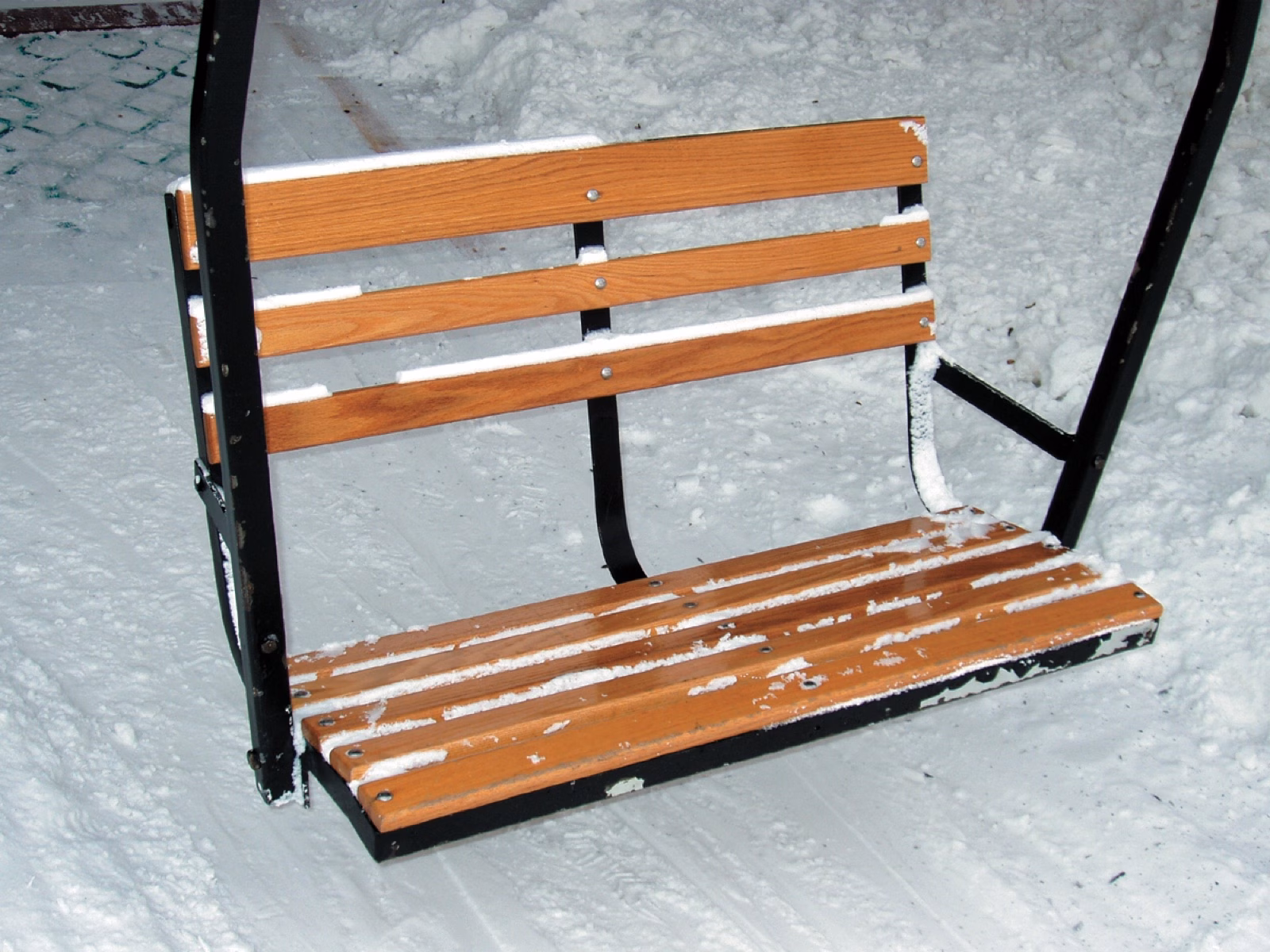 Chairlift seat refinished with clear-coated oak slats