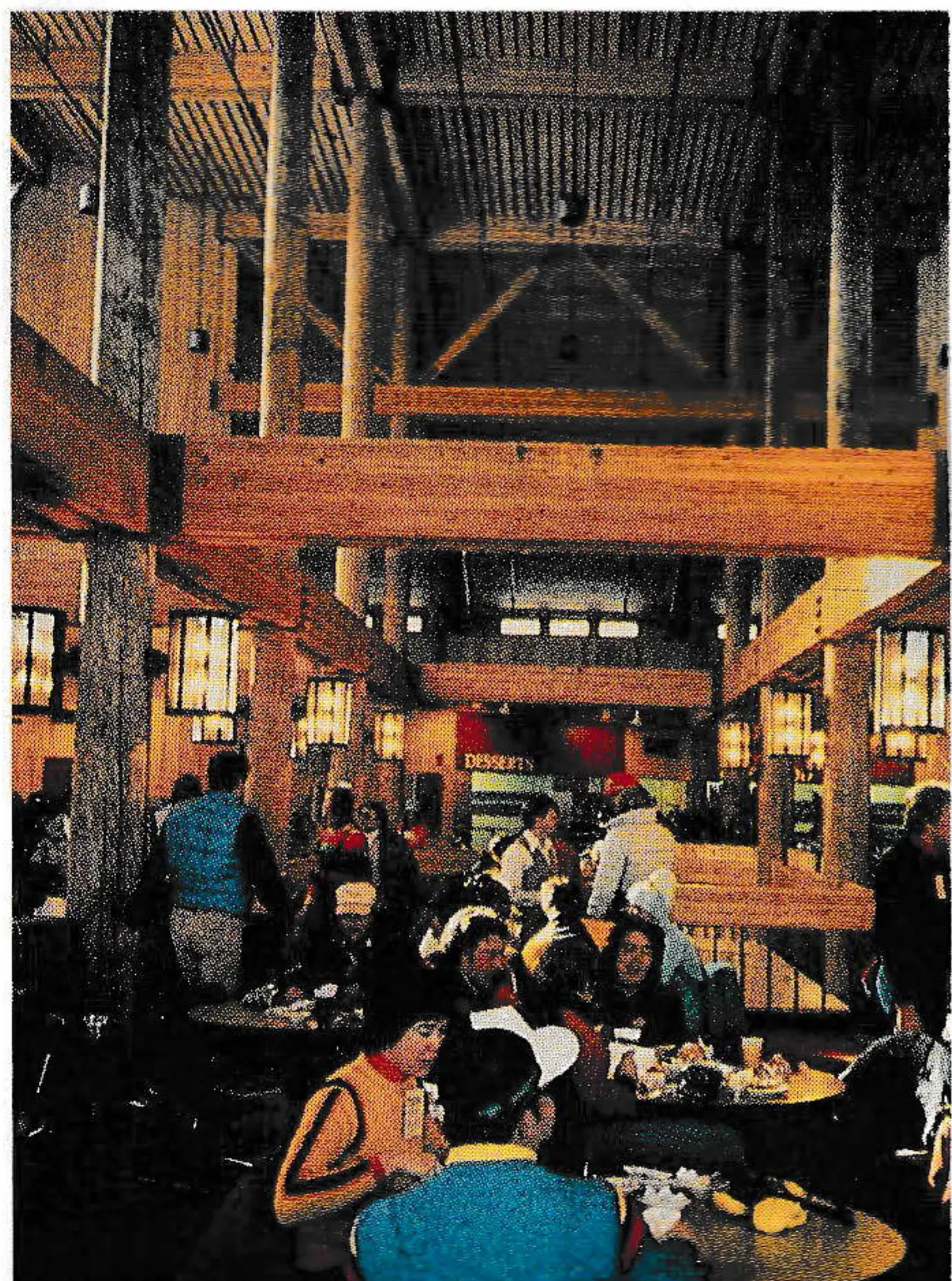 Spruce Saddle's large timber beams and woodsy interior leave no doubt that the building's stylistic roots are in the mountains. A central stairway leads down to restrooms and up for overflow seating. The origional 26,000-square-foot building cost just under $4 million to build in 1980 (roughly $150/square foot); subsequent additions on the lower level and the mezzanine have increased it to about 30,000 square feet.