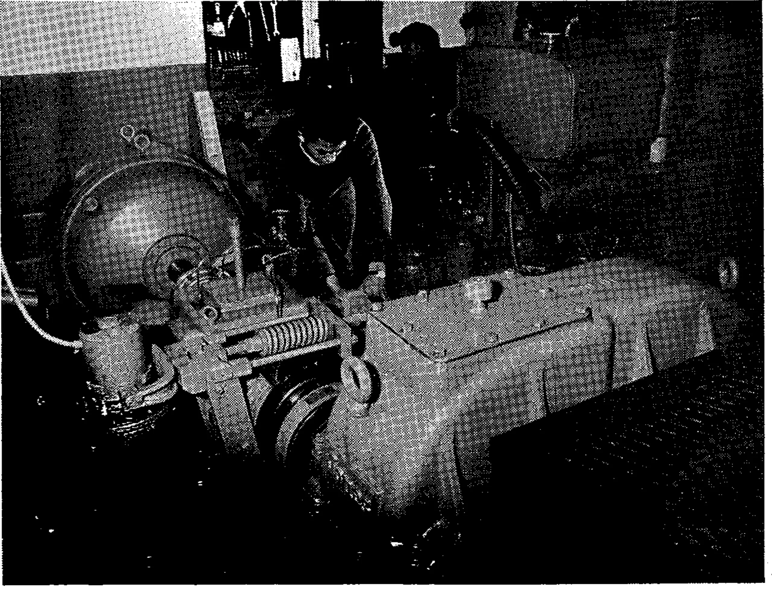 The 125-hp Allis Chalmers engine is installed underground. In extreme foreground is reduction gear box. Any of eight speeds can be selected in control room. Engine at right is gas-driven back-up engine. It can be started and engaged in 5 minutes.