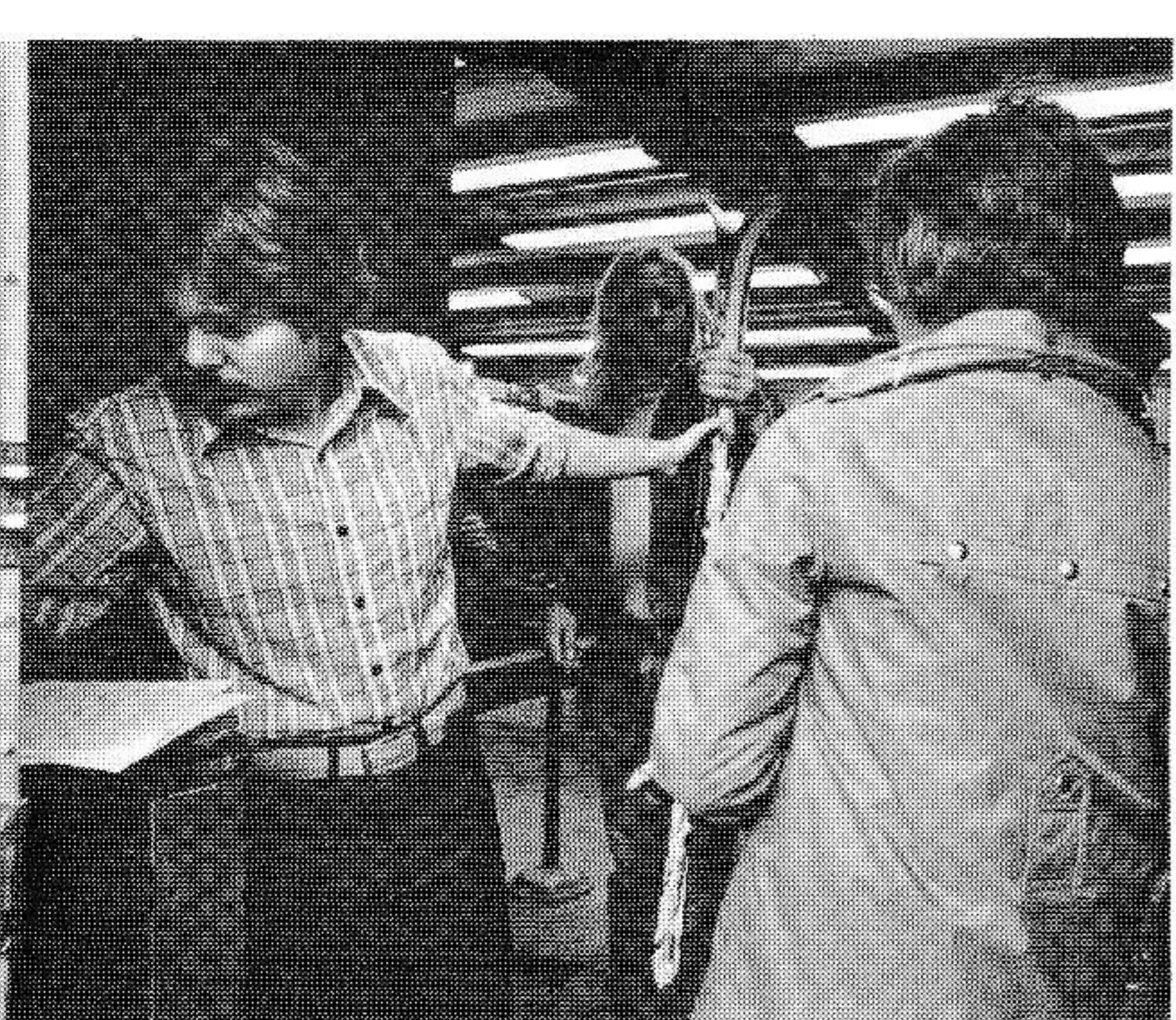 The check-out sheet is now used to check equipment in. Renters are asked name of their school and their own name. Checker then hands skis to another worker who puts them on a cart which, when filled, can be rolled to the ski racks to be hung up.