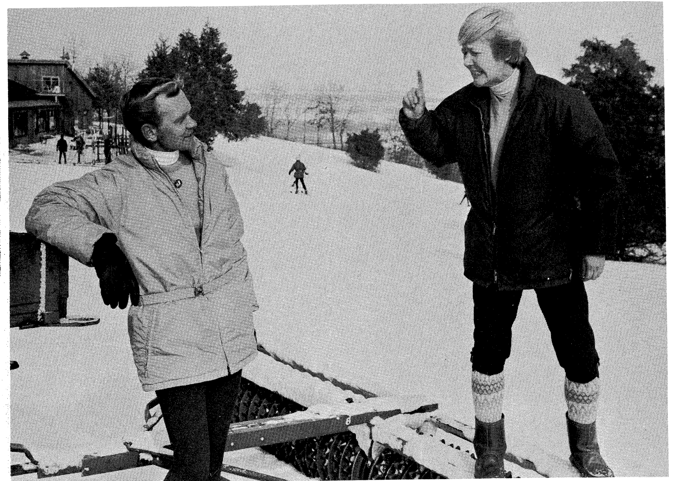 Gabe stops briefly to talk with assistant Henry Bruggerman.
