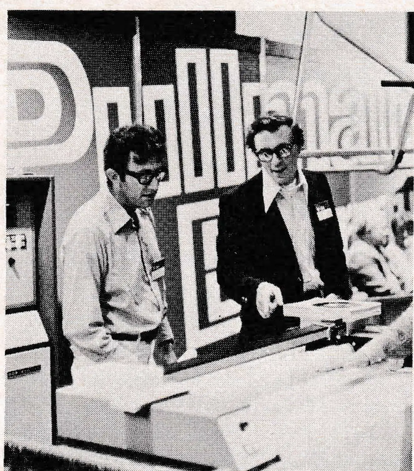 Pullman-Berry's Bill Edwards and Otto Weber inspect firm's new computerized lift-analysis display.