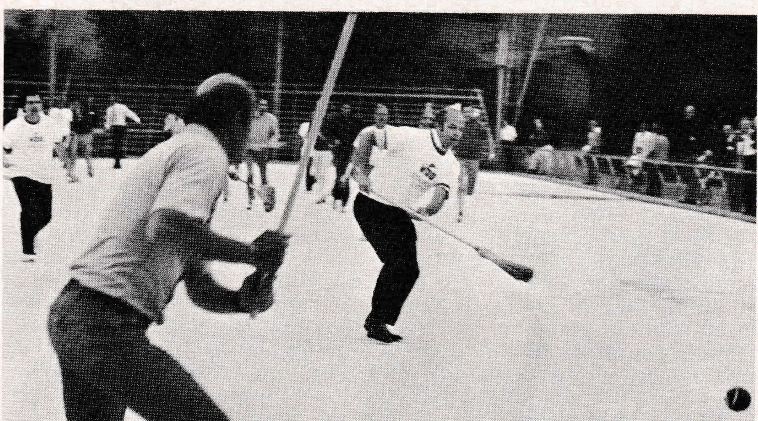 Broomball MVP Bob Loughrey moves to check East's Walt Elliott during NSAA match. Score: East 8, West 3.
