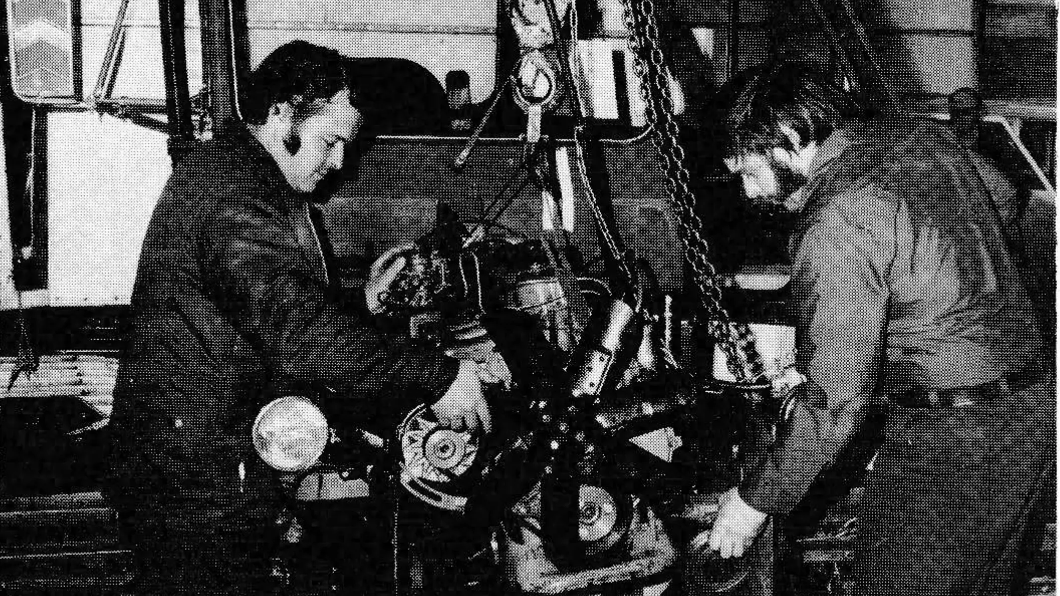 Preventive maintenance is a continuing process. Walt Trout (left) assists mechanic working on a Thiokol.