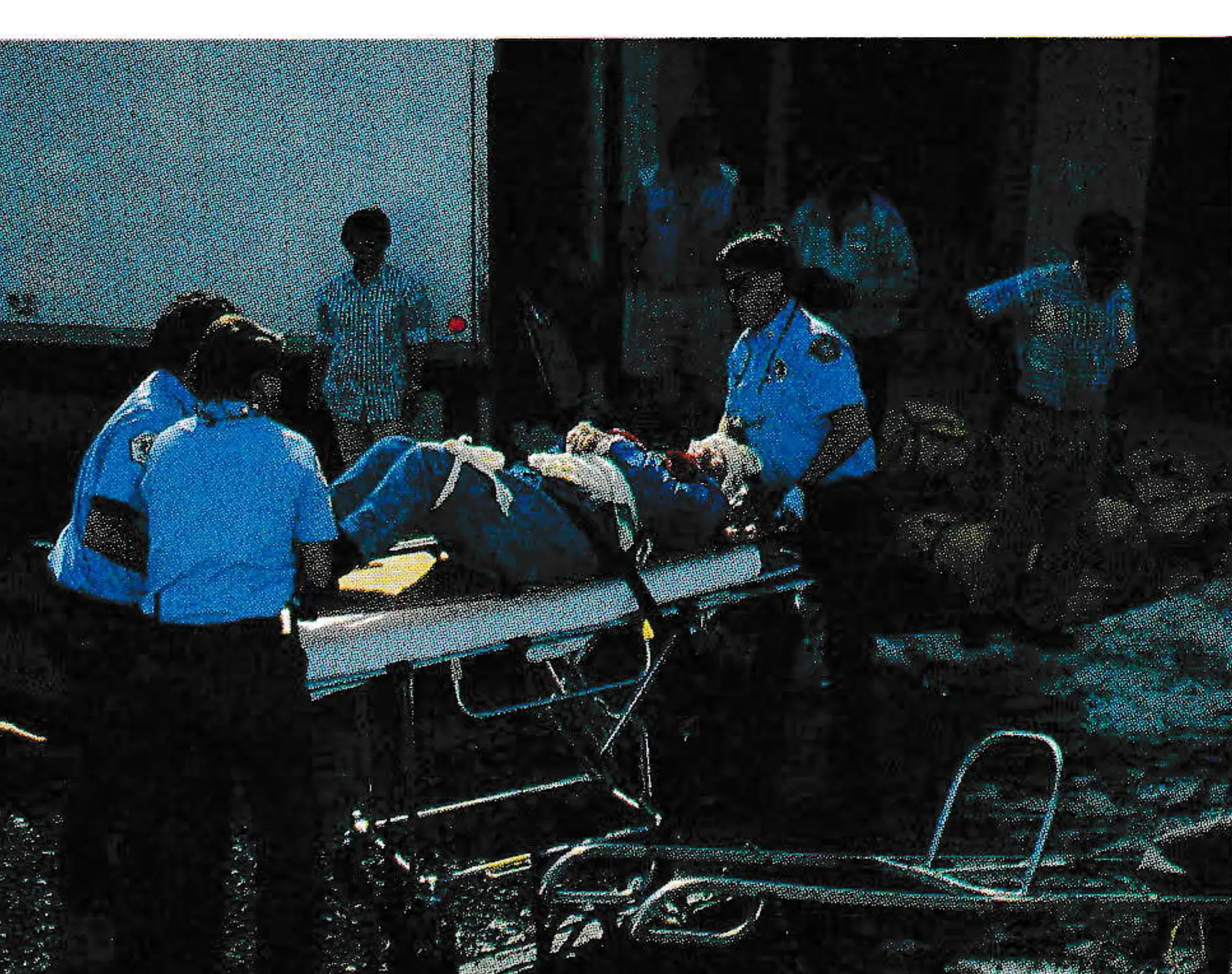 EMTs from Bend and Sunriver (above right) were standing by when the first patients arrived to be moved from parking lot.