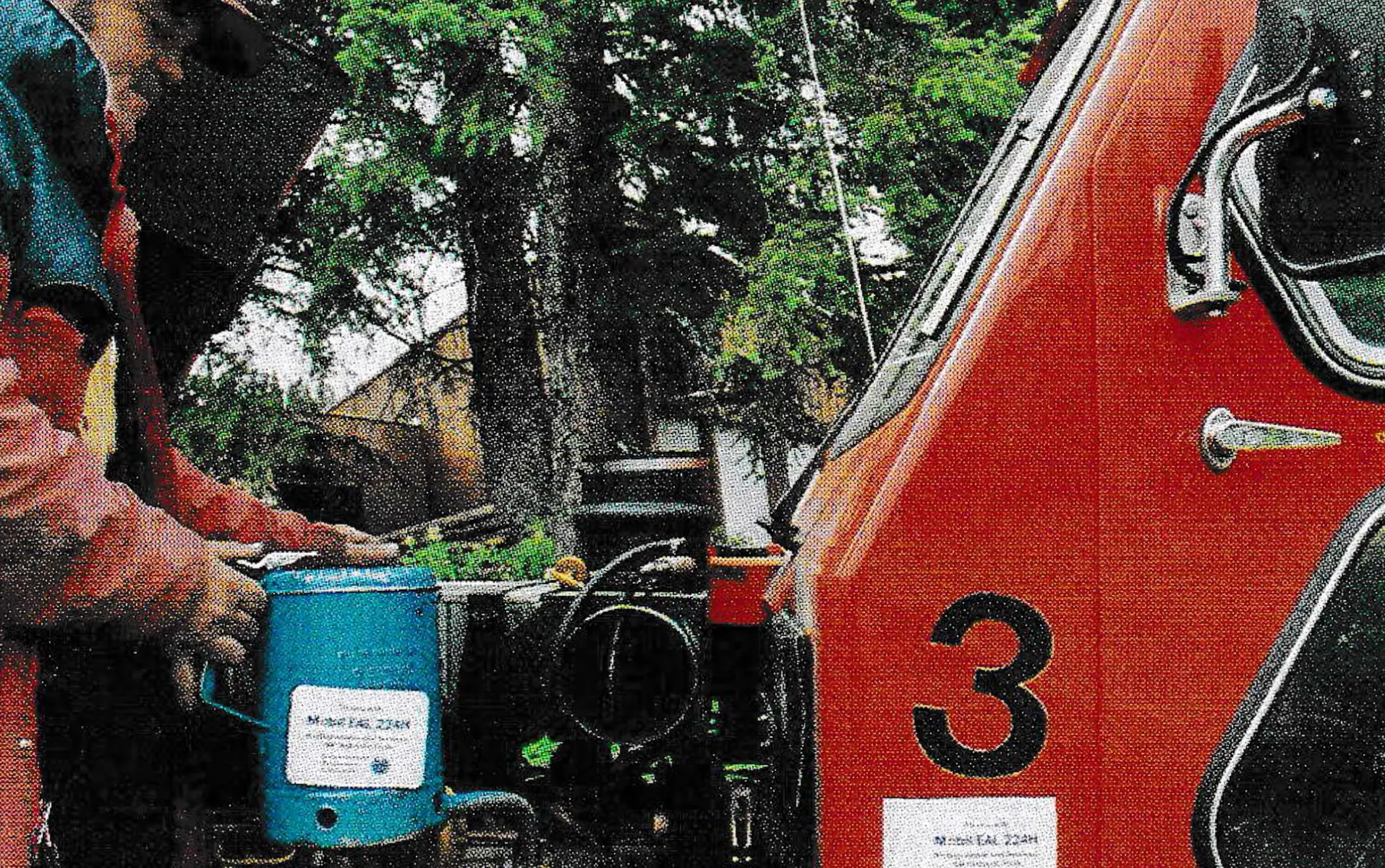 Mobil EAL biodegradable vegetable-base motor oil is added to the tank of a grooming vehicle by Reuel Eck, a Grand Targhee mechanic.