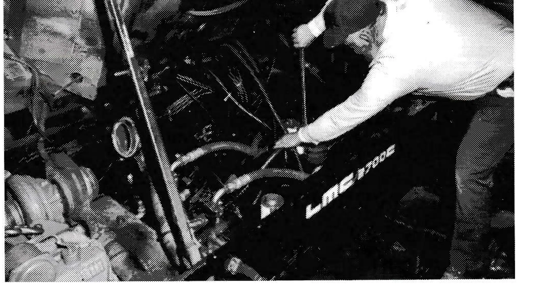 Maintenance mechanic Claude Meyers works on an ultra high-pressure hydraulic hose (6,000 psi range) that connects a hydraulic pump near the engine with a rear drive motor for the tracks. These hoses wear out internally from pressure and temperature.