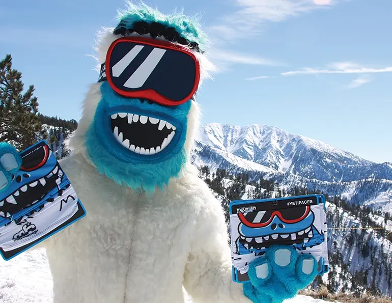 At Mountain High, Calif., the resort’s Yeti costume is incorporated into orientation—by the payroll manager— to help entertain, and introduce staff to company culture. The Yeti welcomes guests (opposite page) equally as well as it does staff.