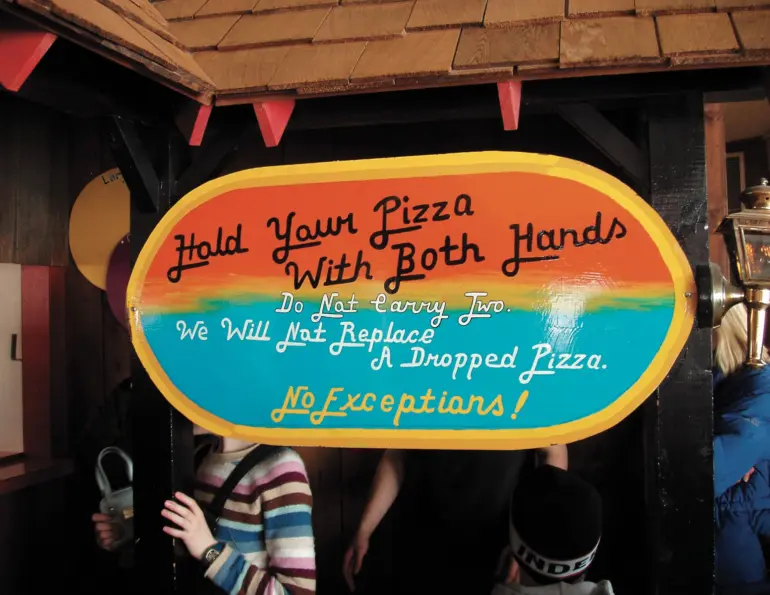 Sign at Wilmot Mountain reading “Hold Your Pizza With Both Hands”