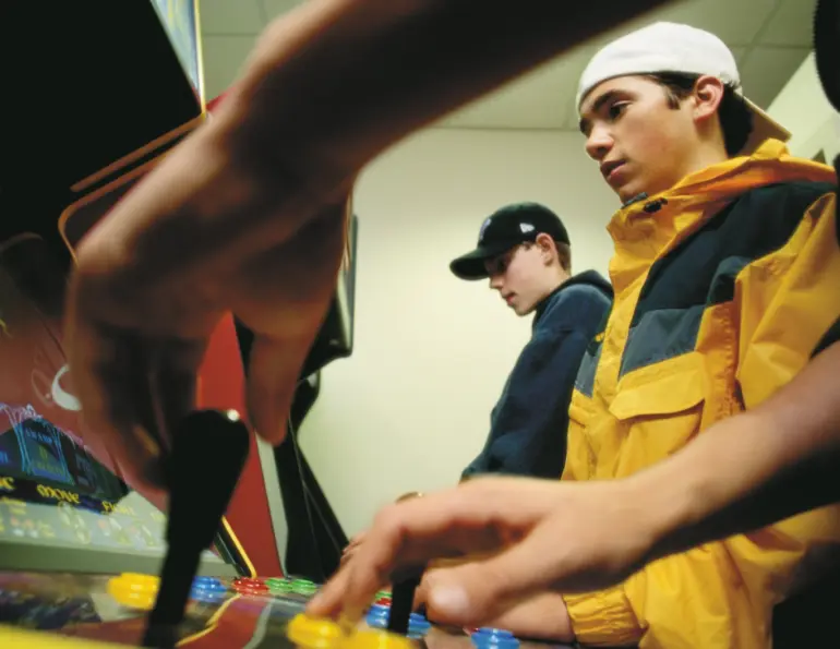 Teenagers absorbed in their own pursuits